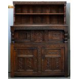 An English oak livery cupboard, late 17th c, altered; carved at later date, 137cm h; 153cm l and