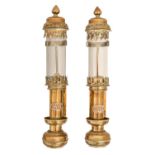 A pair of sheet brass oil lamps, applied G W R badge, glass shades, 26cm h Good condition