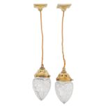 A pair of Edwardian brass and cut glass electric corridor lamp pendants, Holophone Company, early
