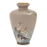 A Japanese cloisonne enamel vase, Meiji period, decorated with three cranes in flight or on a