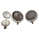 Vintage motoring. A pair of chromium plated motor car headlamps, 25cm diam and two other