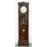 An oak longcase clock, c1930, the three train movement with silvered dial, weights and pendulum,