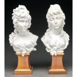 A pair of Royal Worcester glazed porcelain busts of Night and Day designed by Arnold Machin,