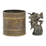 A Chinese dark-patinated bronze dragon head, Qing dynasty, 12cm h, an Indian cylindrical pot,