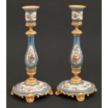 A pair of French gilt brass and Sevres style porcelain candlesticks, c1880, painted with flowers