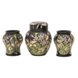 A Moorcroft Isis ginger jar and cover and pair of miniature vases, 2003, 85mm-11.5cm h, impressed