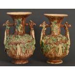 A pair of St Honore Palissy Ware vases, late 19th c, with rustic handles and decorated in high