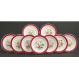 A Limoges dessert service, late 19th c, printed and painted with botanical flowers in claret and