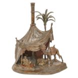 A cold painted Vienna bronze orientalist lamp in the form of an Arab encamped in the desert, Bergman