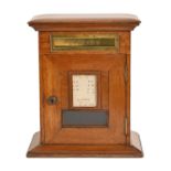 A Victorian oak domestic posting box, c1900, of pillar shape with brass letter slot, fenestrated