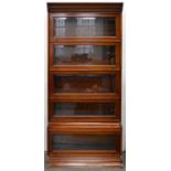 A mahogany sectional bookcase, early 20th c, each of the five sections with bevelled glass light