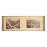 A Victorian photograph album, of 80 mounted whole plate (19 x 27cm and circa) photographs of