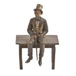 A cold painted Vienna bronze statuette of a man seated on a table, Bergman Foundry, 20th c, 13.5cm