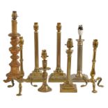A pair of cast brass columnar table lamps, a pair of brass three footed lamps and four various other