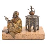 A cold painted Vienna bronze orientalist statuette of an Arab calligrapher, early 20th c, the coffee