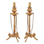 A pair of Napoleon III gilt bronze tripod candlesticks, draped with chains, adapted as lamps, 28cm h