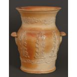 An English saltglazed brown stoneware jar and strainer, Lambeth, early 19th c, with shell handles