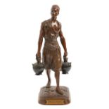 A French orientalist bronze statuette of "Le Porteur d'deau Tunisien", cast from a model by Jean