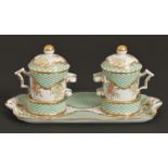 A pair of French porcelain cups and covers on socketed tray, 20th c, decorated in 18th c style on