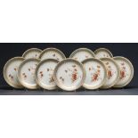 A set of eleven Royal Worcester dessert plates, 1890 and 94, gilt with naturalistic poppies on a