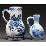 A German spirally lobed faience jug and a similar smaller Delft Ware jug, probably Dutch, both