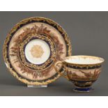 A German cobalt ground cabinet cup and saucer, c1900, painted with a continuous scene of