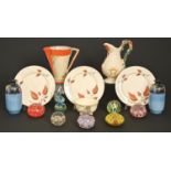 Miscellaneous ornamental ceramics and glass paperweights, to include a set of three Clarice Cliff [