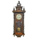 A walnut Vienna wall clock, c1900, pendulum, 110cm h In apparently good condition save for minor
