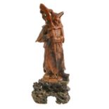A Chinese soapstone statuette of Zhou Cang, on affixed carved soapstone base, 32.5cm h Good