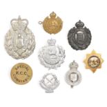 Police. Round brass K.C.C. Special Constable badge and seven various other helmet/cap badges, all