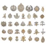 An extensive collection of British army metal cap badges, including many regiments and corps, an ARP
