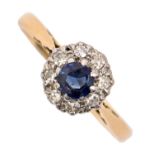 A sapphire and diamond cluster ring, gold hoop marked 18ct PLAT, head 8mm diam, 2.5g, size M Good