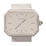 An Omega 9ct white gold octagonal lady's wristwatch, 18 x 25mm, on tapered 9ct white gold bracelet