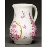 A Worcester sparrow beak cream jug, c1765, painted in puce monochrome with flowers, the central