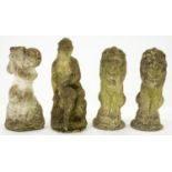 Four reconstituted stone garden ornaments, including a pair of seated lions, 50cm h and circa