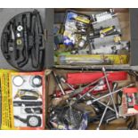 Miscellaneous tools and car parts, including stereos, wheel brace, Jaguar hub caps, etc