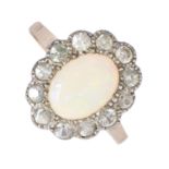 An opal and white stone cluster ring, gold hoop marked 9ct SIL, 2.4g, size P Good condition