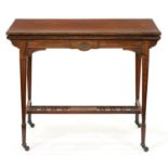 A late Victorian rosewood card table, on square tapered legs with pierced stretcher, pottery