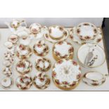 A Royal Albert Old Country Roses pattern dinner service and a wall clock, printed mark Good