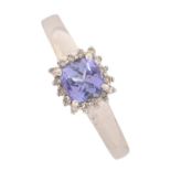 A tanzanite and diamond cluster ring, in 18ct white gold, Birmingham 2007, 3g, size M, certificate