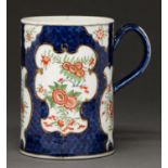 A Worcester scale blue ground mug, c1770, painted in kakiemon style with chrysanthemums and