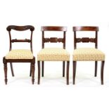 A pair of George IV mahogany and line inlaid dining chairs, with tablet centred back rail on sabre