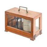 A German, Third Reich, military issue walnut barograph, with brass tablet engraved with eagle device