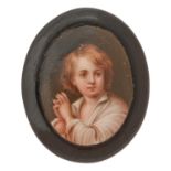 A black composition brooch set with a Continental porcelain miniature, c1870, printed and painted