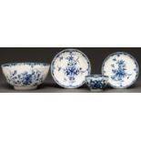 A Worcester blue and white slop basin, tea bowl and two saucers, c1770, painted with the Mansfield