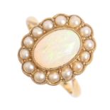An opal and split pearl cluster ring, in gold marked 18ct, 4.1g, size L½ Good condition. Opal of