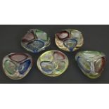 Five mid-century Romanian blue, red and green cased glass ashtrays, 16cm and circa and four