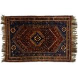 A Persian style rug, 20th c, blue ground with geometric motifs in earthy tones, 240 x 170cm