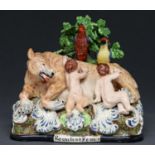 A Staffordshire earthenware group of Romulus and Remus suckled by the she wolf, c1825-30, with