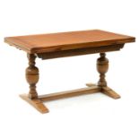 An oak draw leaf table, 20th c, with cleated ends, 76cm h; 83 x 137cm (unextended) Good condition